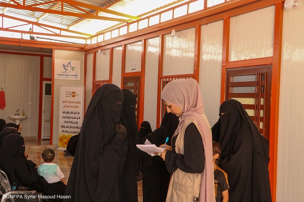 A woman receives vital support and assistance at Al-Hol camp, finding hope amidst hardshi