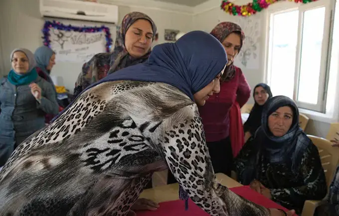 After flight from Syria, refugee women in Iraq find safety, support